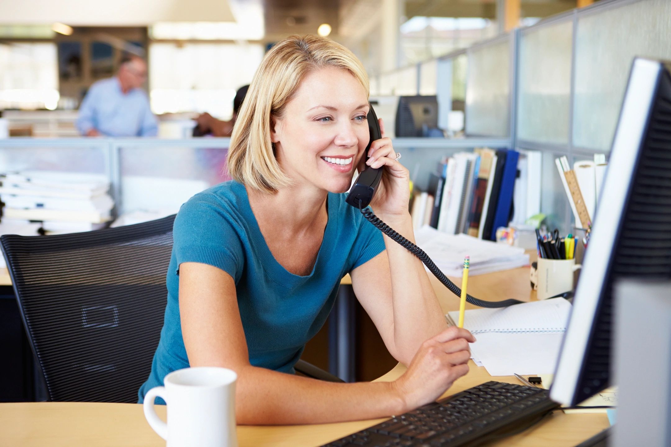 Professional woman using VOIP phone service | Open One Solutions Chicago IL